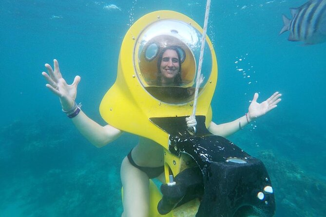 Experience a Submarine Scooter with ScubaDoo Punta Cana - The glass-bottom boat and snorkeling stop