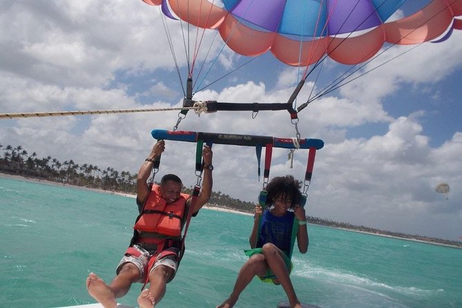 From Punta Cana: Amazing Activity Parasailing Hotel pickup - Boarding the small boat