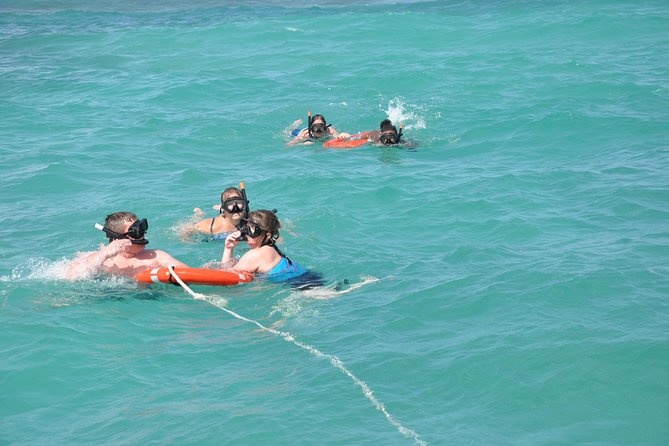 Great Snorkeling Cruise with Sharks & Stingray Encounter and Natural Pool - Getting to the beach and boarding the boat