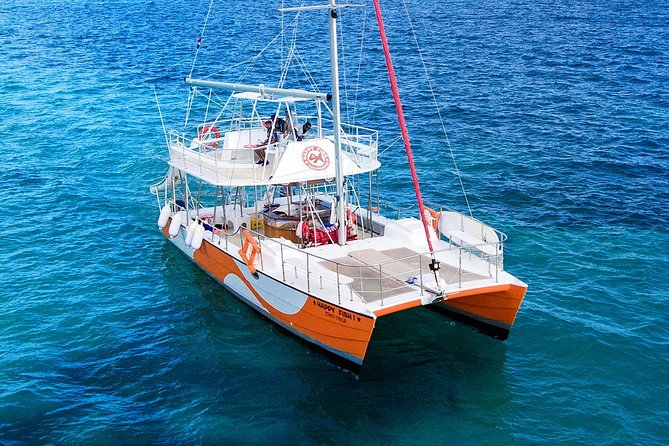 Small Group Snorkeling Cruise with Open Bar and Light Snacks - Boarding the catamaran near Punta Cana